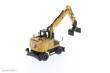 Diecast Masters 85956 - Caterpillar M318 Mobilbagger mit extra Werkzeug