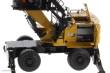 Diecast Masters 85958 - Caterpillar MH3040 Umschlagsbagger